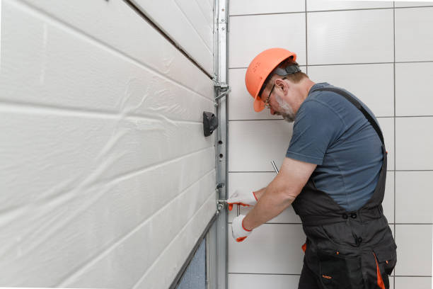 Technician repairing garage door spring